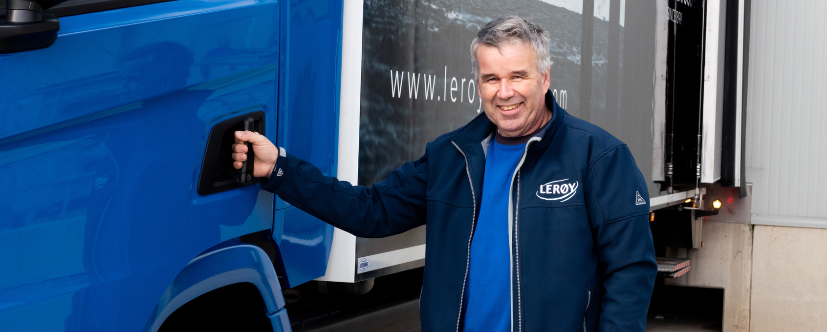 Employee in front of car